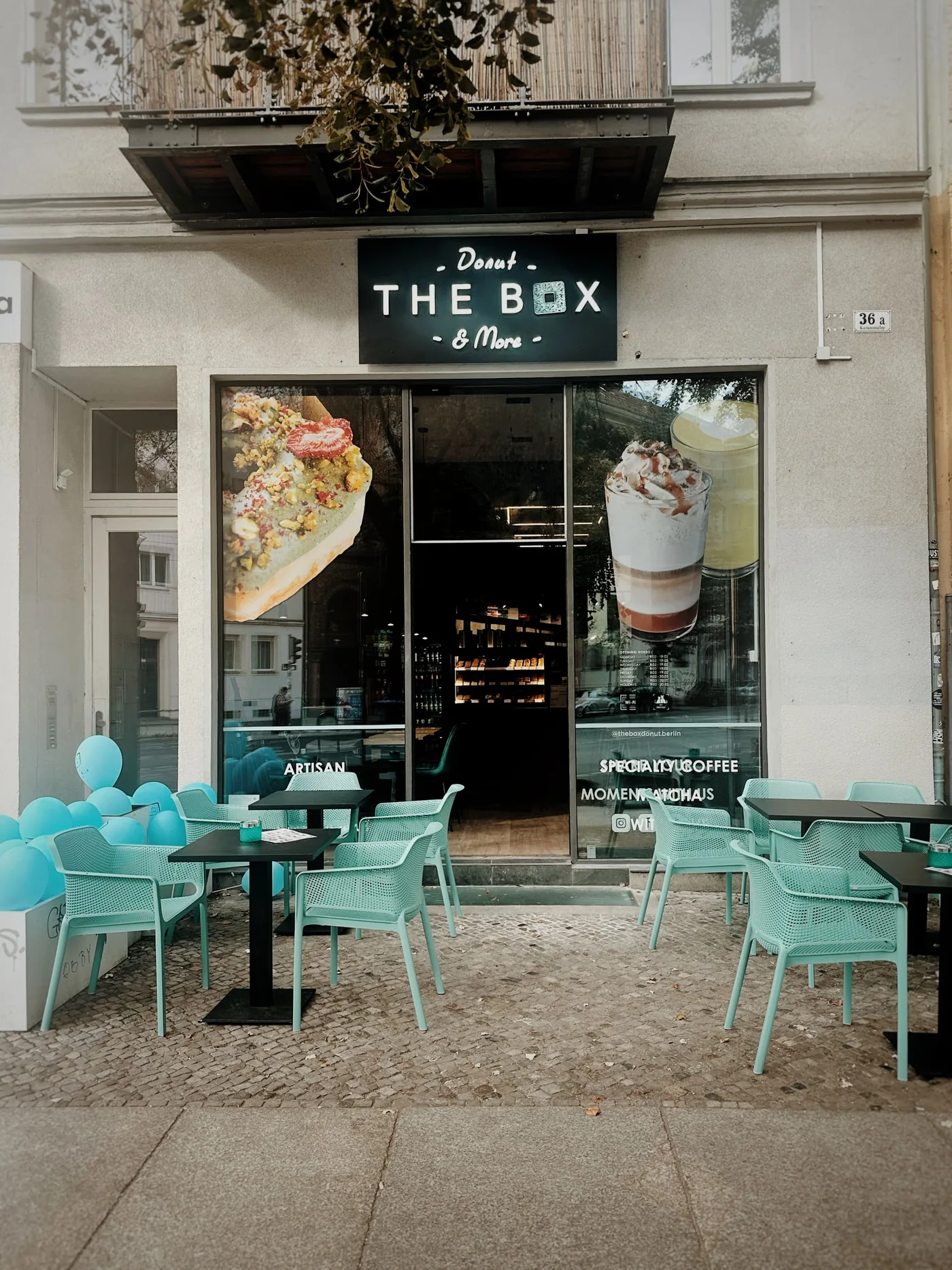 The Box Berlin storefront on Kastanienallee with its outdoor seating